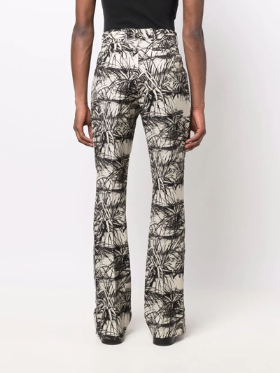 Shop Amiri Graphic-print Flared Trousers In Nude