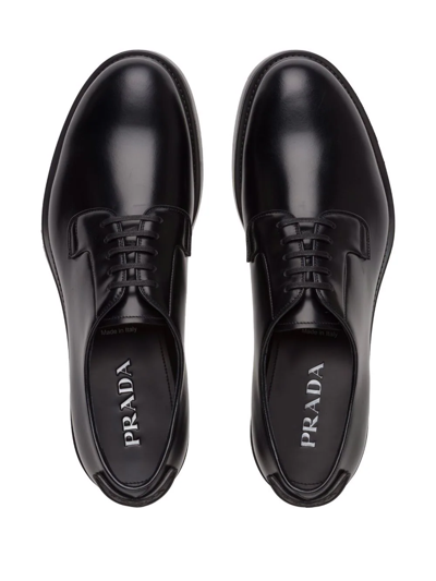 Shop Prada Brushed-leather Lace-up Shoes In Black