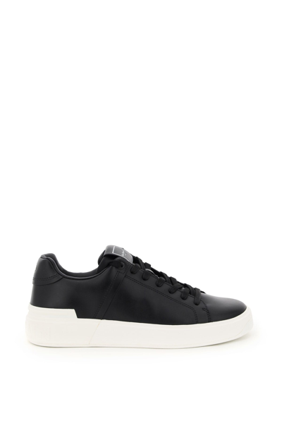 Shop Balmain B Court Leather Sneakers In Noir Blanc (black)