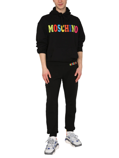 Shop Moschino Multicolor Logo Jogging Pants In Nero