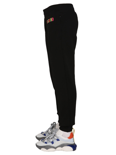 Shop Moschino Multicolor Logo Jogging Pants In Nero