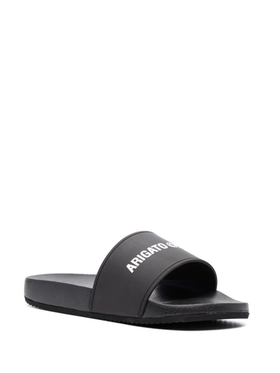 Shop Axel Arigato Logo-print Slides In Schwarz