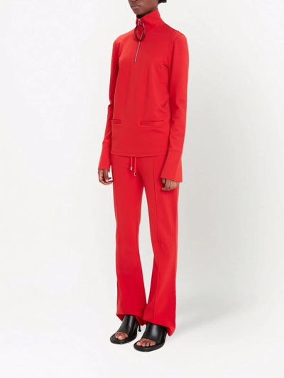 Shop Jw Anderson Kick-flare Track Pants In Red