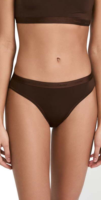 Shop Calvin Klein Underwear Bikini Mid Rise Panties Umber201