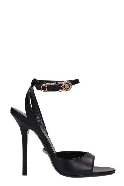 Shop Versace Sandals In Black Leather