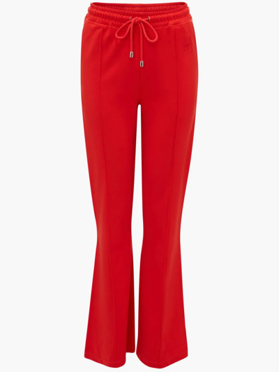 Shop Jw Anderson Slim Flare Track Pants In Red