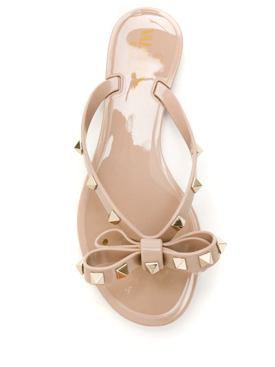 Shop Valentino Rockstud Thong Sandals In Neutrals