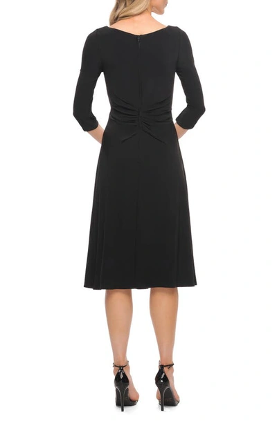 Shop La Femme Ruched Jersey Faux Wrap Dress In Black