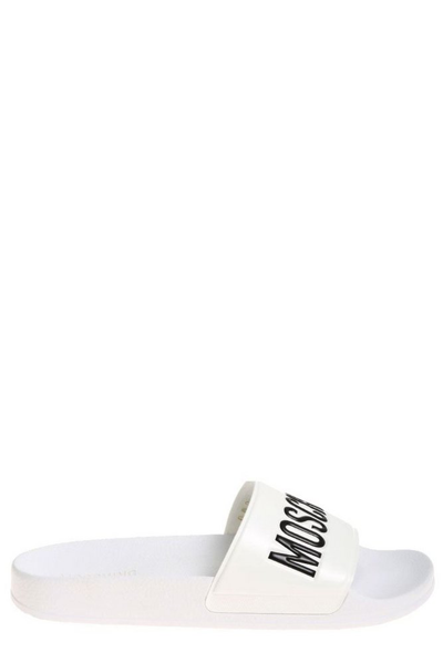 Shop Moschino Logo Embossed Pool Slides In White