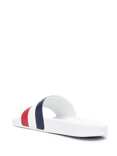 Shop Moncler Striped Embossed-logo Slides In Weiss