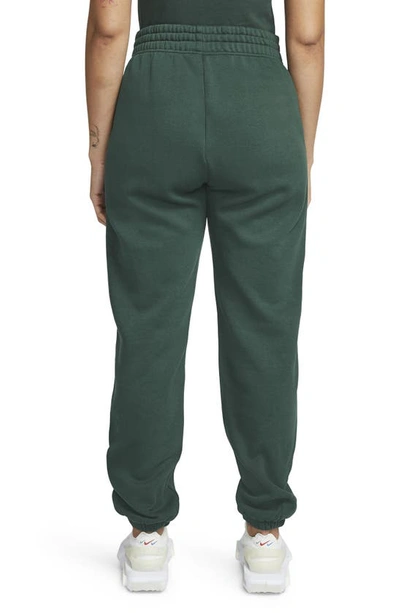 Shop Nike Sportswear Essential Fleece Pants In Pro Green/ White