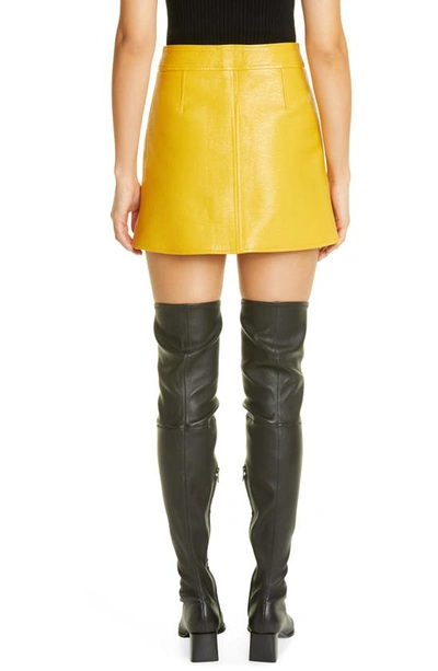 Shop Courrèges Coated Stretch Cotton Miniskirt In Ochre
