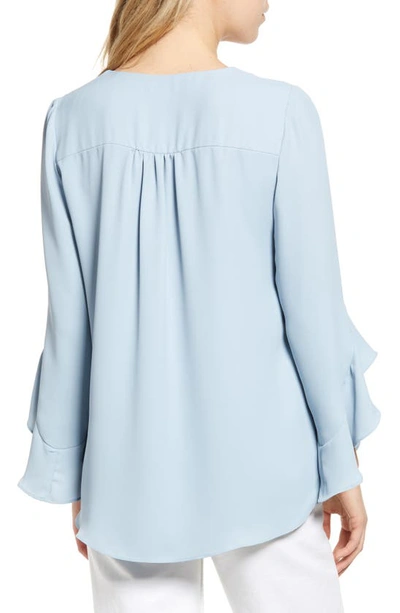 Shop Vince Camuto Flutter Sleeve Tunic In Blue Willow