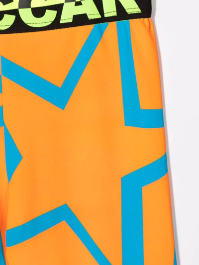 Shop Stella Mccartney Star-print Panelled Leggings In Orange