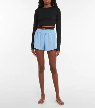 Shop Alo Yoga Stride Shorts In Tile Blue