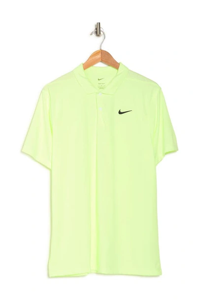 Shop Nike Dri-fit Essential Solid Polo Shirt In Barely Volt/black