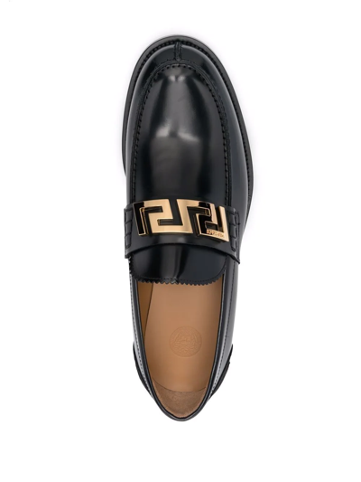 Shop Versace Greca Leather Loafers In Schwarz