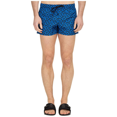 Shop Versace Greca Logo Printed Drawstring Swim Shorts In Blue