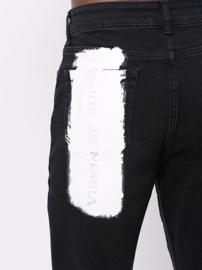 Shop Vision Of Super Paint-print Tapered Jeans In Black