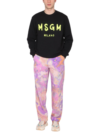 Shop Msgm Tie Dye Pattern Pants In Lilac