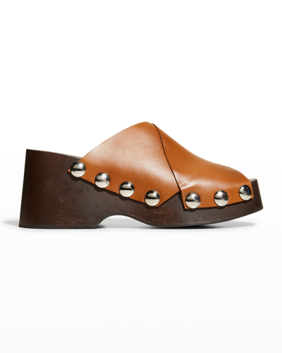 Shop Ganni Retro Crisscross Clog Mules In Tigers Eye