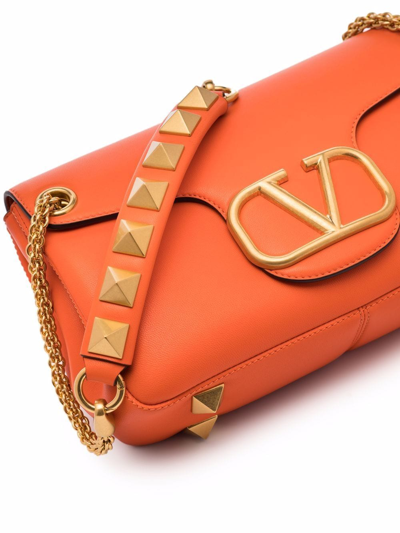 Shop Valentino Stud Sign Shoulder Bag In Orange