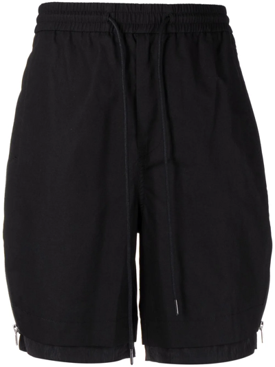 Shop Juunj Exposed Zip Double Layer Shorts In Schwarz