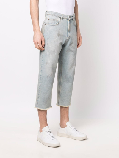 磨损边露踝牛仔裤