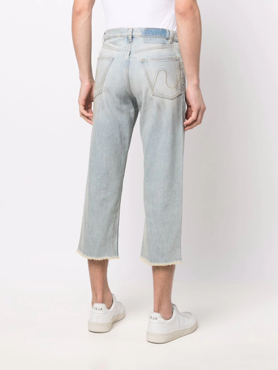 磨损边露踝牛仔裤