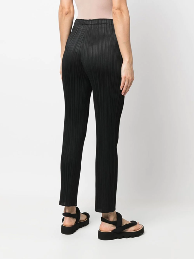 Shop Issey Miyake Elasticated-waist Slip-on Straight Trousers In Schwarz