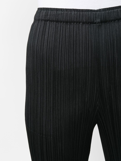 Shop Issey Miyake Elasticated-waist Slip-on Straight Trousers In Schwarz