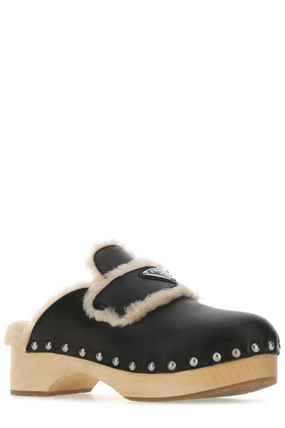 Shop Prada Triangle Logo Shearling-trim Clogs In Nero+sabbia