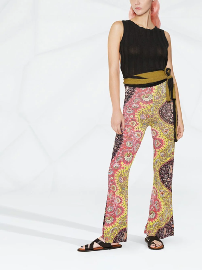 Shop Etro Paisley-print Flared Trousers In Gelb
