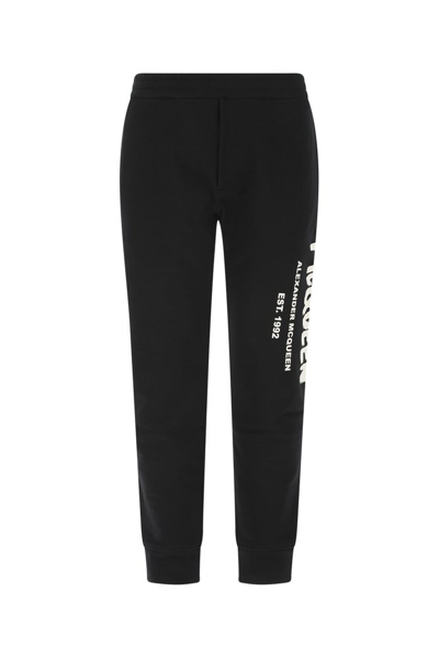 Shop Alexander Mcqueen Logo Printed Tapered Leg Trousers In Black