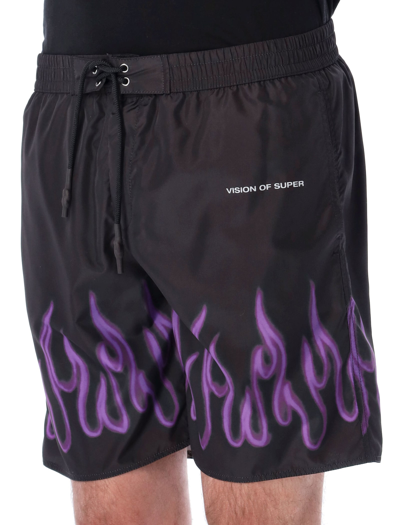 Shop Vision Of Super Pulple Flame Spray Print Swim Shorts In Black