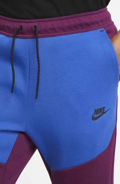 Shop Nike Tech Fleece Jogger Sweatpants In Sangria/ Game Royal/ Black