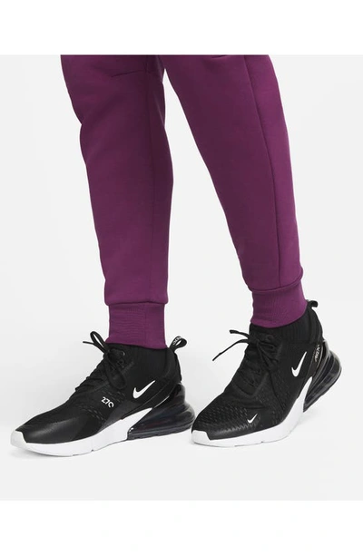 Shop Nike Tech Fleece Jogger Sweatpants In Sangria/ Game Royal/ Black