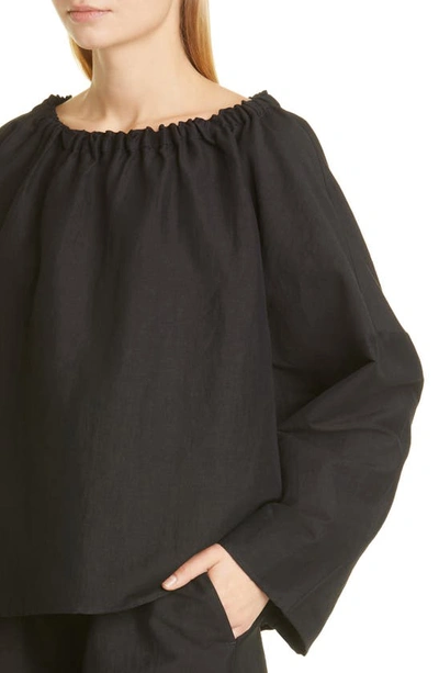 Shop Totême Elastic Neck Stretch Linen Blend Blouse In Black