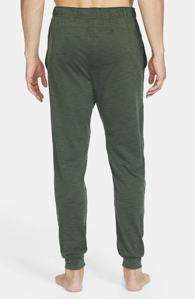 Shop Nike Pocket Yoga Pants In Galactic Jade/ Sequoia