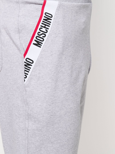 Shop Moschino Logo-waistband Trousers In Grau