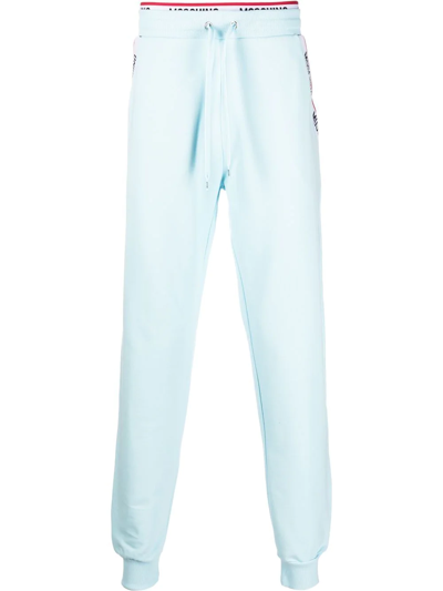 Shop Moschino Logo-print Trim Track Pants In Blau