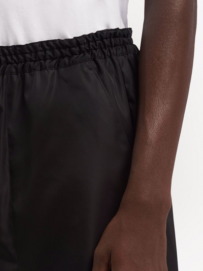 Shop Prada Re-nylon Bermuda Shorts In Black