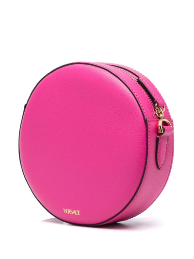 Shop Versace La Medusa Round Crossbody Bag In Pink