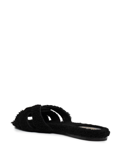 Shop Saint Laurent Tribute Shearling Slides In Schwarz