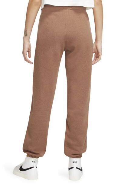 Shop Nike Sportswear Essential Fleece Pants In Mineral Clay/ Heather/ White