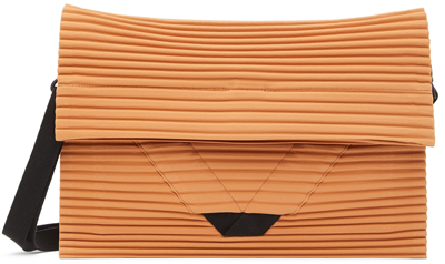 Shop Issey Miyake Orange Pleats Flat Messenger Bag In 32-orange