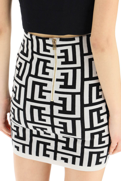 Shop Balmain Monogram Knit Mini Skirt In White,black