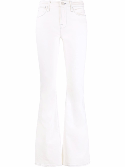 Shop Frame Le High Flared Jeans In White