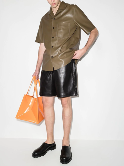 Shop Nanushka Short-sleeved Faux Leather Shirt In Grün