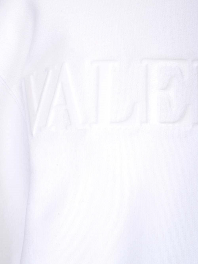 Shop Valentino Logo Embossed Jersey Sweatshirt In Bianco